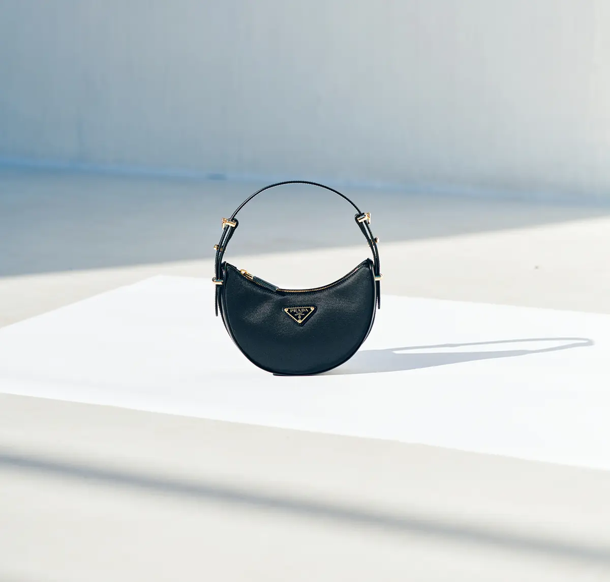 “Prada Arché” Re-Nylon x Brushed Leather Mini Shoulder Bag